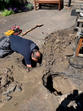 Path to church showing digging for water repairs